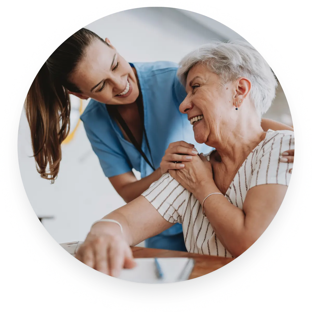 A VIPcare caregiver smiling with a senior patient